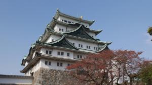 a tall white tower with a tree in front of it at Toyoko Inn Nagoya Marunouchi in Nagoya