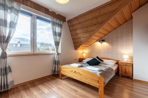 Posteľ alebo postele v izbe v ubytovaní Apartamenty pod Słońcem