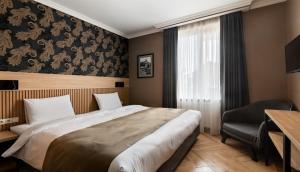 Postel nebo postele na pokoji v ubytování Hotel Old Wall