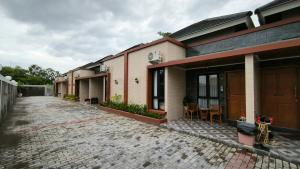 a row of houses on a brick road at Premier Homestay Syariah in Kalasan