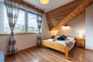 Posteľ alebo postele v izbe v ubytovaní Apartamenty pod Słońcem
