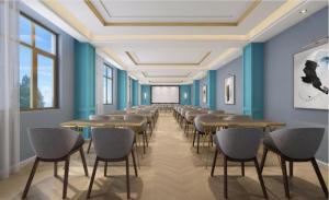 a row of tables and chairs in a room with blue walls at Magnotel Hotel Chengdu Taikoo Li Dongfeng Bridge A in Chengdu