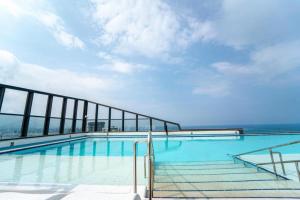 a swimming pool on the top of a building at The BlueMark Hotel Sokcho in Sokcho