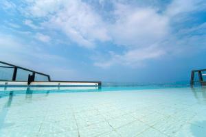 a swimming pool on the roof of a building at The BlueMark Hotel Sokcho in Sokcho