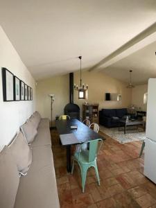 a living room with a couch and a table at Casita rural entre olivos in Biar