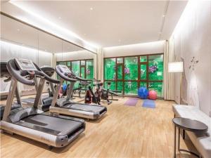 a gym with several exercise bikes in a room at E-Cheng Hotel Changchun Yiqi West High-Speed Railway Station in Changchun
