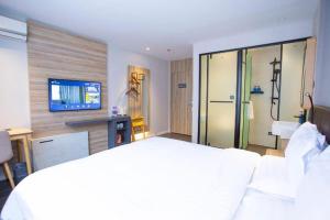 Katil atau katil-katil dalam bilik di Hanting Hotel Guangzhou Dongpu KeyunZhan