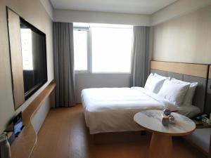 Ji Hotel Beijing Shangdi Nongda Nan Road房間的床