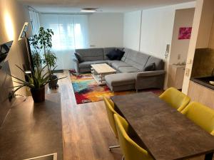 a living room with a couch and a table at TOP Ferienwohnung in Bad Urach