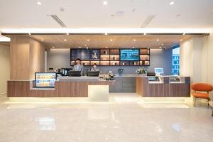 Lobby alebo recepcia v ubytovaní Hanting Hotel Jinan International Expro Center