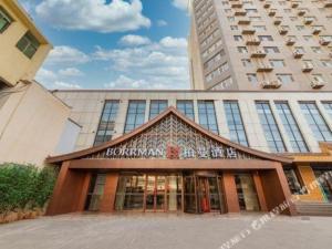 een gebouw voor een hoog gebouw bij Borrman Hotel Jinan Yijia Exhibition Center Laotun Metro Station in Jinan