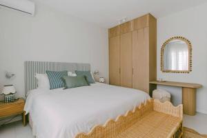 Postel nebo postele na pokoji v ubytování Tamarin Sunset Beach IV