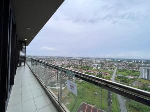 a view of a city from a building balcony at Nick's Homestay @Boulevard mall @ Imperial Suites in Kuching
