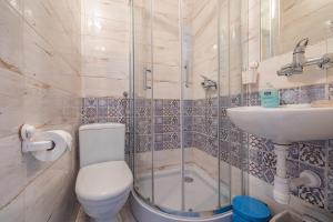 a bathroom with a toilet and a sink and a shower at Pokoje na Równi Zakopane in Zakopane