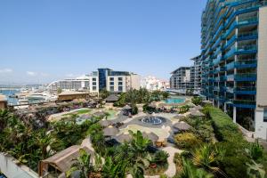 an aerial view of a resort with a swimming pool at Ocean Village 2 bedroom apartment in Gibraltar