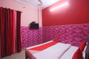 Voodi või voodid majutusasutuse Sangam Guest House toas