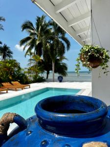a blue planter sitting next to a swimming pool at Villa Teri in Lipa Noi