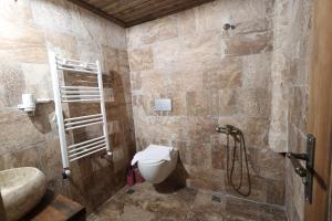 a bathroom with a toilet and a sink at Cappadocia Snora Cave in Nevsehir