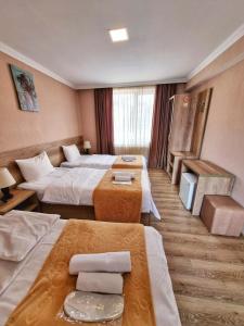 Postelja oz. postelje v sobi nastanitve Sunshine Kazbegi