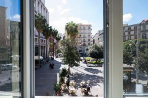 a view of a city street from a window at Dimora Trecuori in Naples