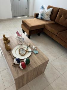 a living room with a couch and a coffee table at Techas Near Beach Apt Tarrafal in Tarrafal +13 photos
