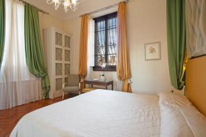 Posteľ alebo postele v izbe v ubytovaní Serristori Palace Residence