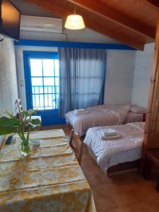 Postel nebo postele na pokoji v ubytování Blue Garden