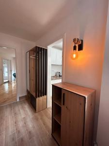 a room with a wooden cabinet and a mirror at Kosancic No.1 in Belgrade