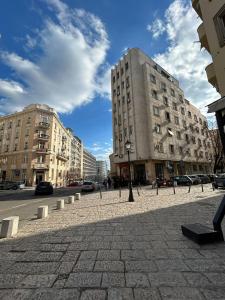 a city street with two tall buildings and a building at Kosancic No.1 in Belgrade