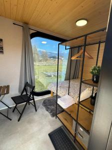 a room with a desk and a chair in a tiny house at Tatry Panorama House in Zuberec