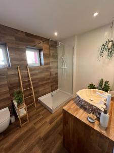 a bathroom with a shower and a toilet and a sink at Apartament BOHO in Częstochowa