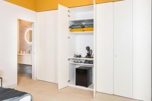A kitchen or kitchenette at Loggiato Verga Luxury by Bed&Bros