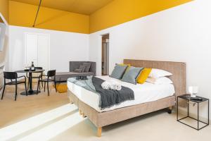 A bed or beds in a room at Loggiato Verga Luxury by Bed&Bros
