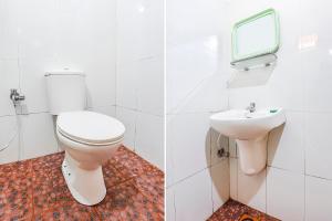 a bathroom with a toilet and a sink at FabHotel Angelo's Inn in Calangute