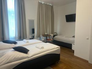 Rúm í herbergi á Hotel Soers