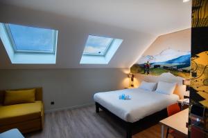 Postel nebo postele na pokoji v ubytování ibis Styles Clermont-Ferrand Aéroport