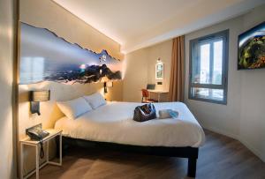 Postel nebo postele na pokoji v ubytování ibis Styles Clermont-Ferrand Aéroport