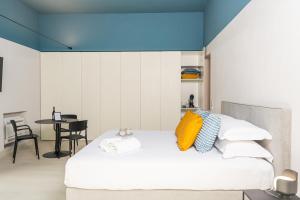 A bed or beds in a room at Loggiato Verga Luxury by Bed&Bros