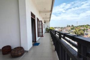 a balcony of a building with a view of a city at Multi Villa Gold in Galle