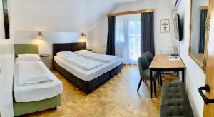 Postel nebo postele na pokoji v ubytování Hotel Maj Inn
