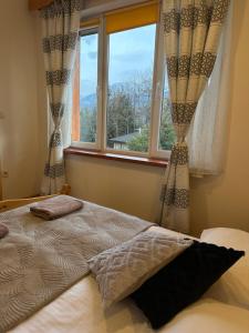 Posteľ alebo postele v izbe v ubytovaní Apartamenty pod Słońcem