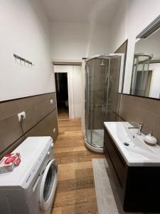 a bathroom with a washing machine and a sink at Miramare in Nettuno +43 photos