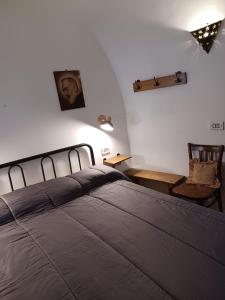 Säng eller sängar i ett rum på Trullo Vacanza