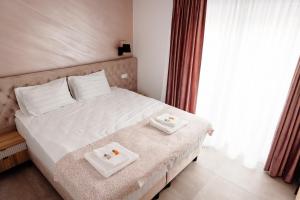 En eller flere senge i et værelse på Park View Apartment 1