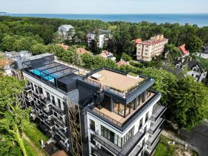 an aerial view of a building with a roof at Apartamenty Świnoujście -Seaside Garden 52 in Świnoujście