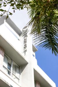 a hotel sign on the side of a building at Crest Hotel Suites in Miami Beach