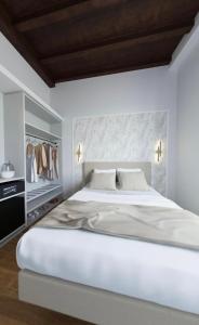 Postel nebo postele na pokoji v ubytování Maison Romana Trastevere Suites