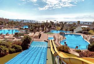 an aerial view of a water park with two pools at Beach & Fun: Cozy Studio in La Pineda