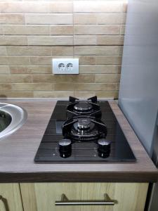 A cozinha ou cozinha compacta de Apartmani Paunovic Lux 1