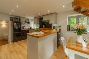 a kitchen with a counter top and a table at The Maltings in Trunch